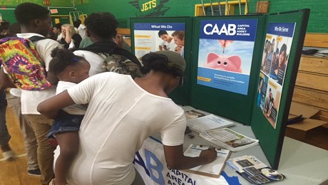 CAAB Engages with Ward 8 Families Attending Back to School Night at Charles Hart Middle School to Raise Awareness of the EITC 